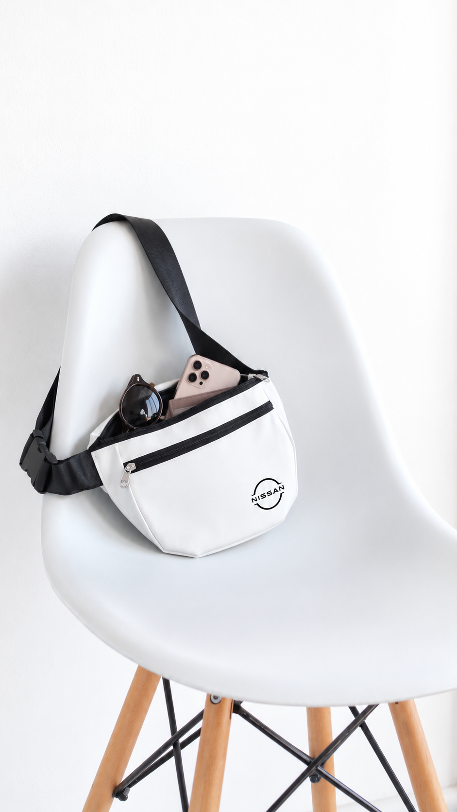 The sling bag resting on a chair